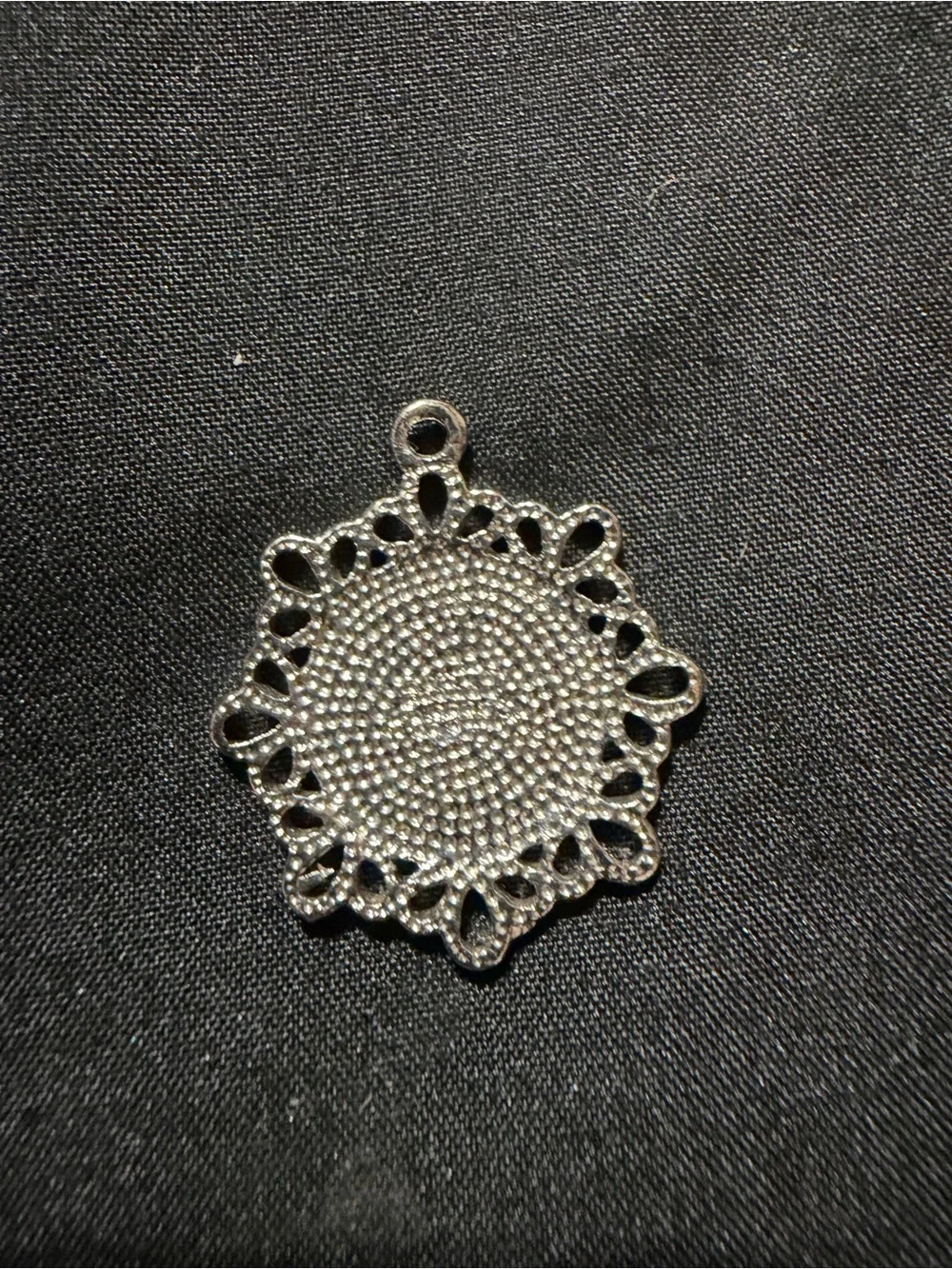 silver-finished pendant featuring a mint-green enamel center with the Arabic